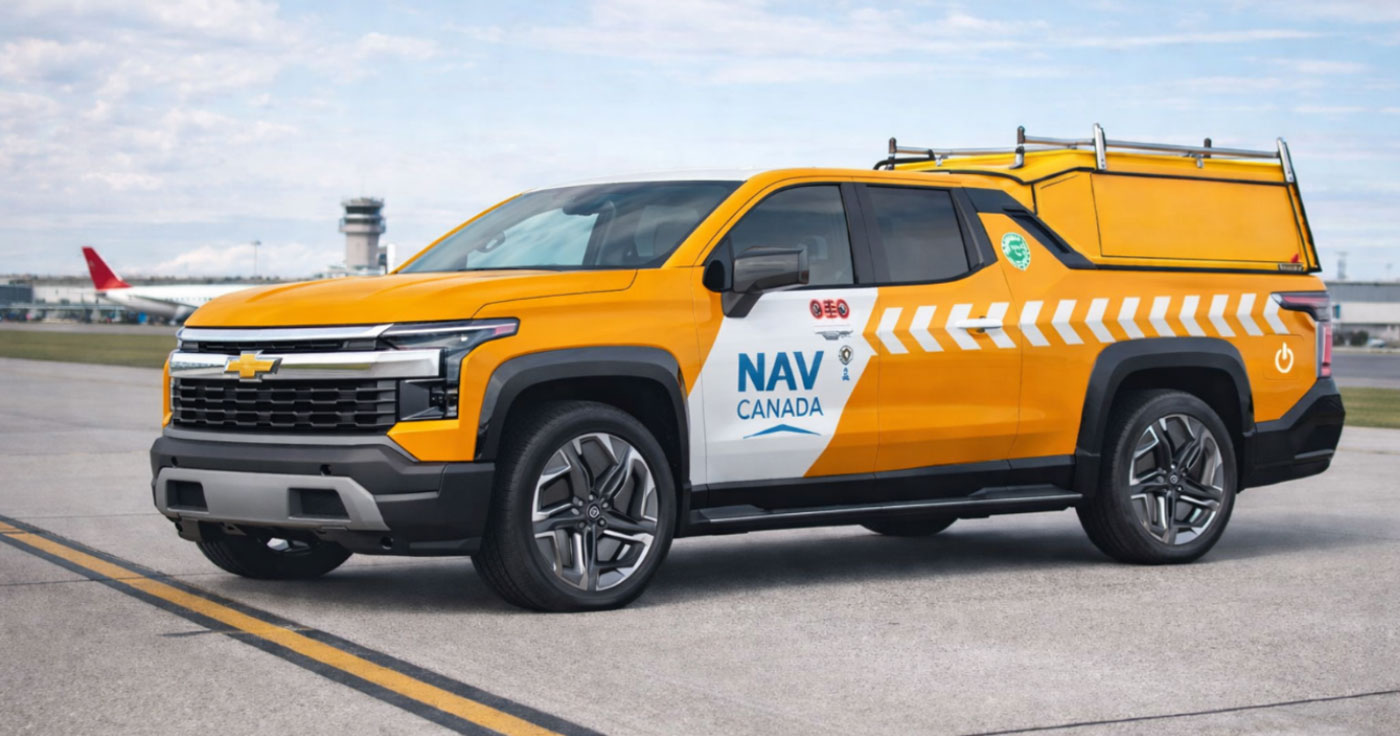 Rendering of NAV CANADA electric pickup truck in signature yellow and white livery with roof rack at airport location as part of fleet sustainability pilot