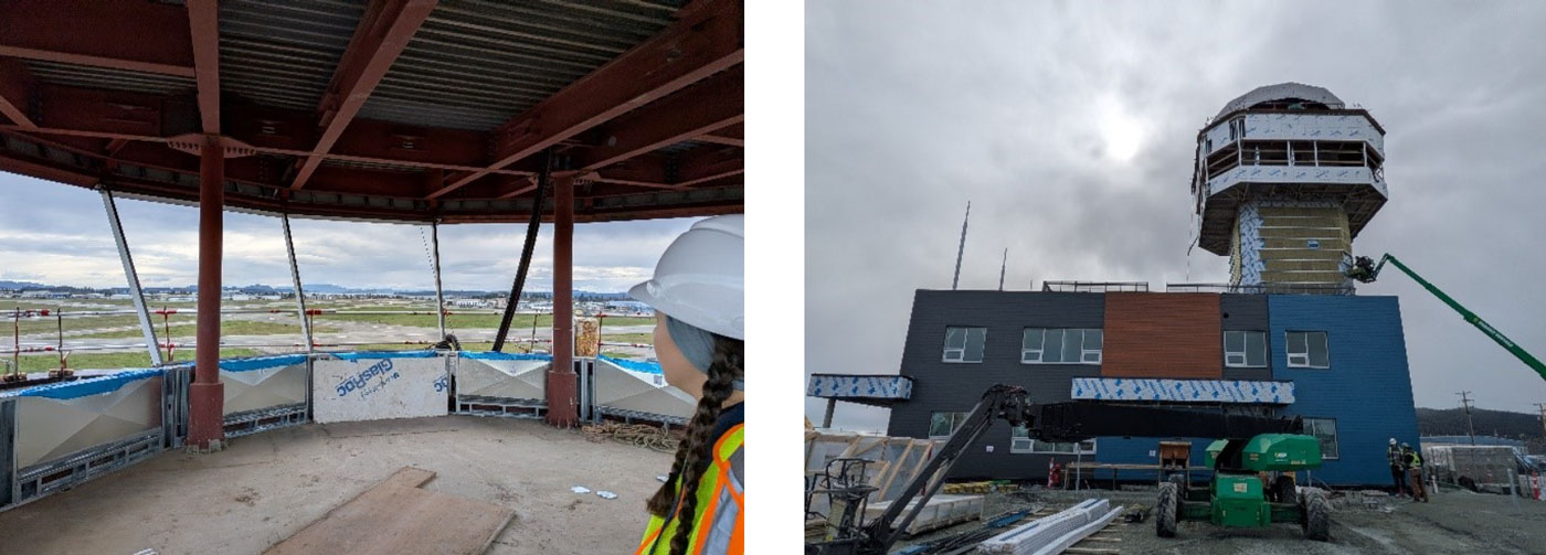 Interior view from NAV CANADA Victoria Airport Control Tower under construction showing panoramic windows overlooking airport runways and mountains.