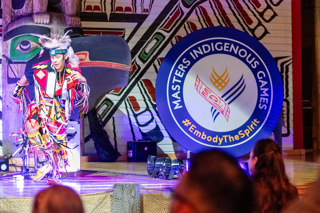 An Indigenous performer onstage at a Masters Indigenous Games Event.